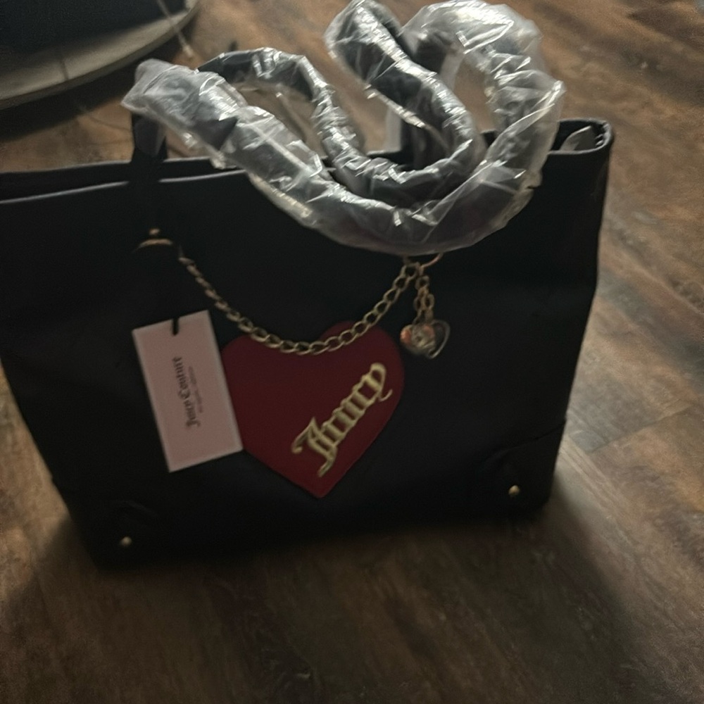Black gorgeous juicy couture purse !! Brand new still with tags and plastic